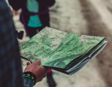 person holding a topographical map