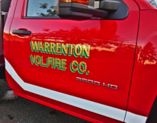 vehicle lettering on a red truck